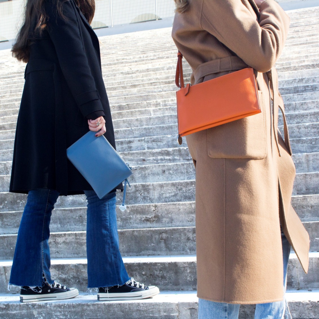 Double Zipper Crossbody Bag Linda in Fairy and Orange worn by Women on stairs of Square Colosseum (EUR)