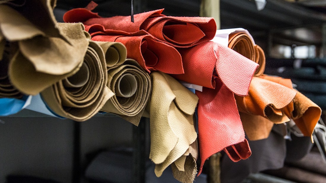 Assorted rolls of sustainable italian leather in vibrant colors