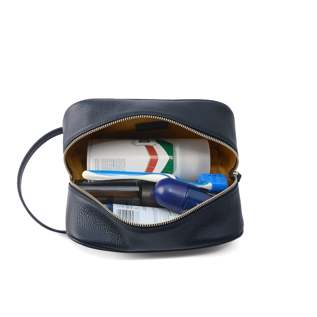 Leather toiletry bag filled with grooming essentials