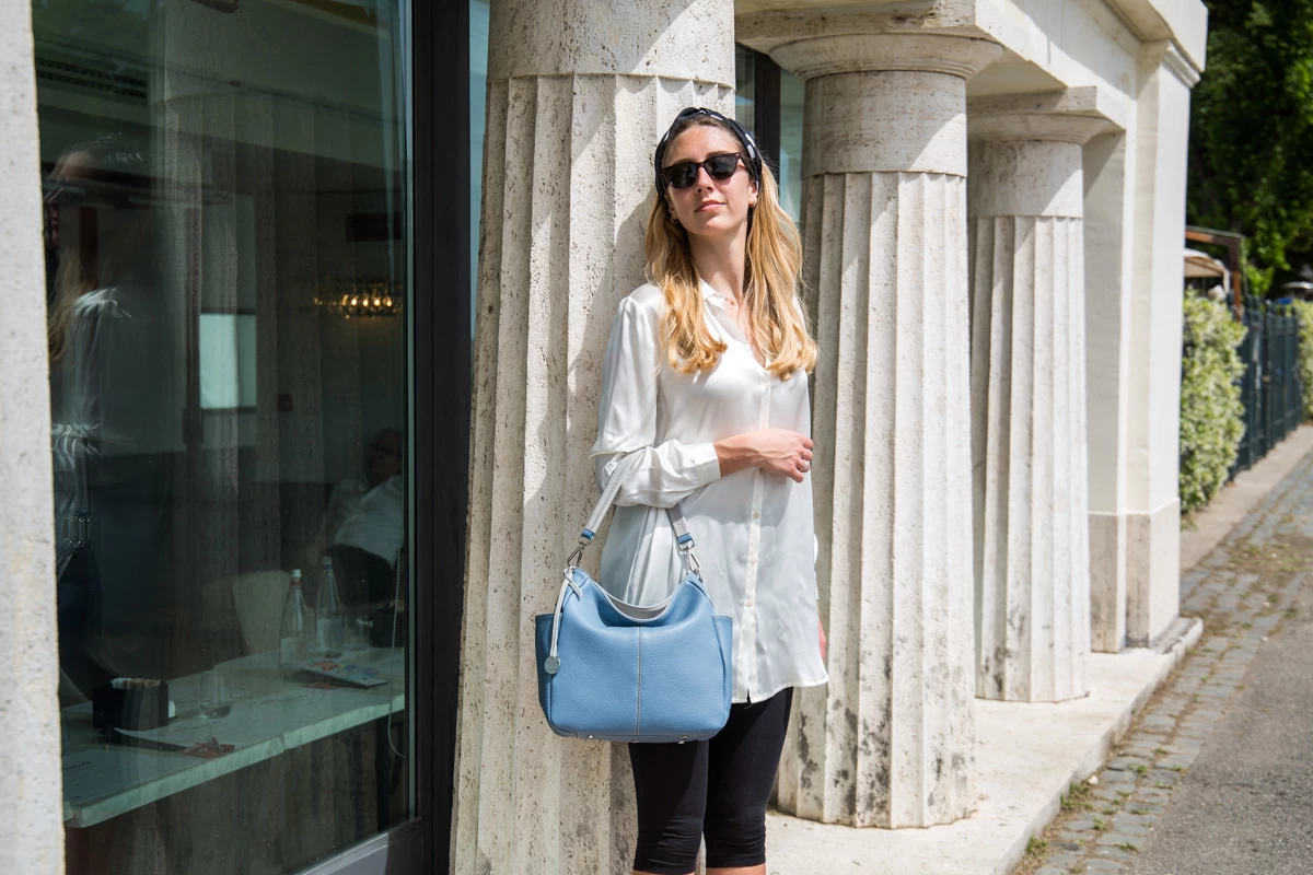 woman wearing an Italian leather shoulder bag